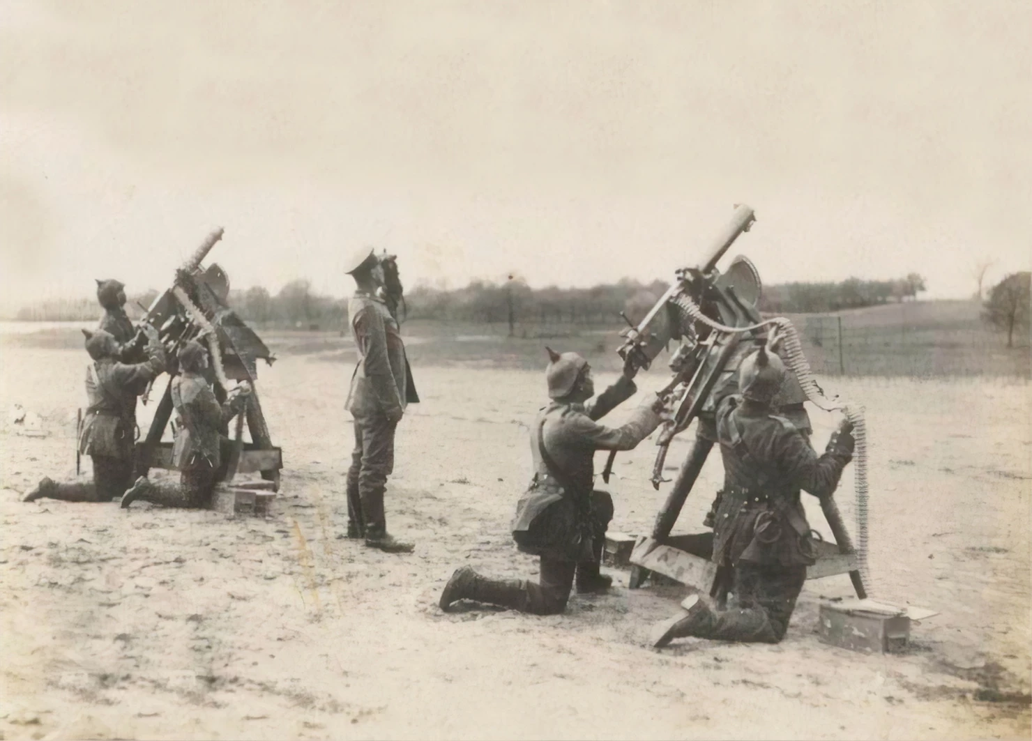 Old photo of soliders aiming mounted guns