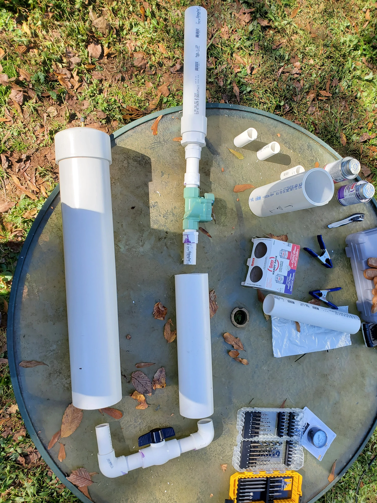 PVC pipe and other parts, partially assemblied, laid on a table