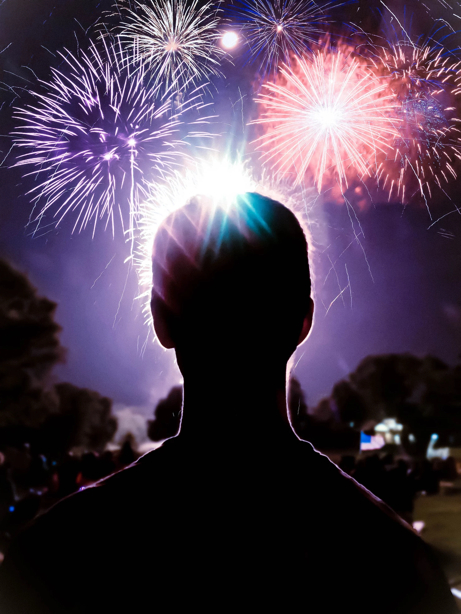 Photo of man watching fireworks